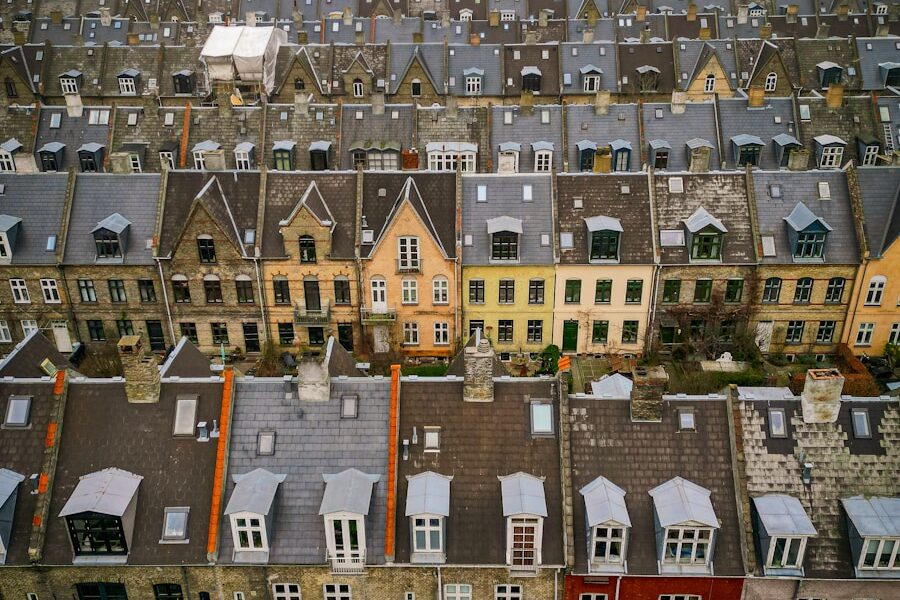 an aerial view of a city with lots of houses